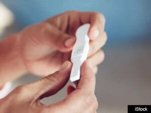 Hands holding fertility test
